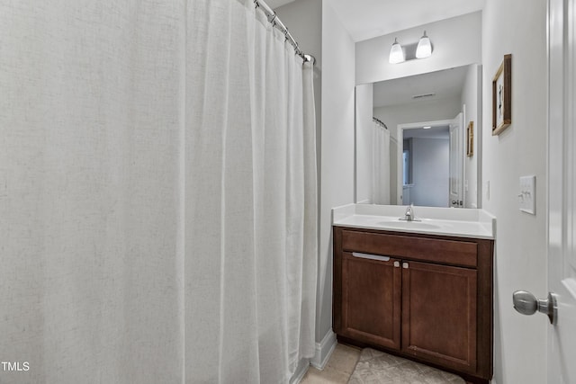 bathroom with vanity and tile patterned flooring