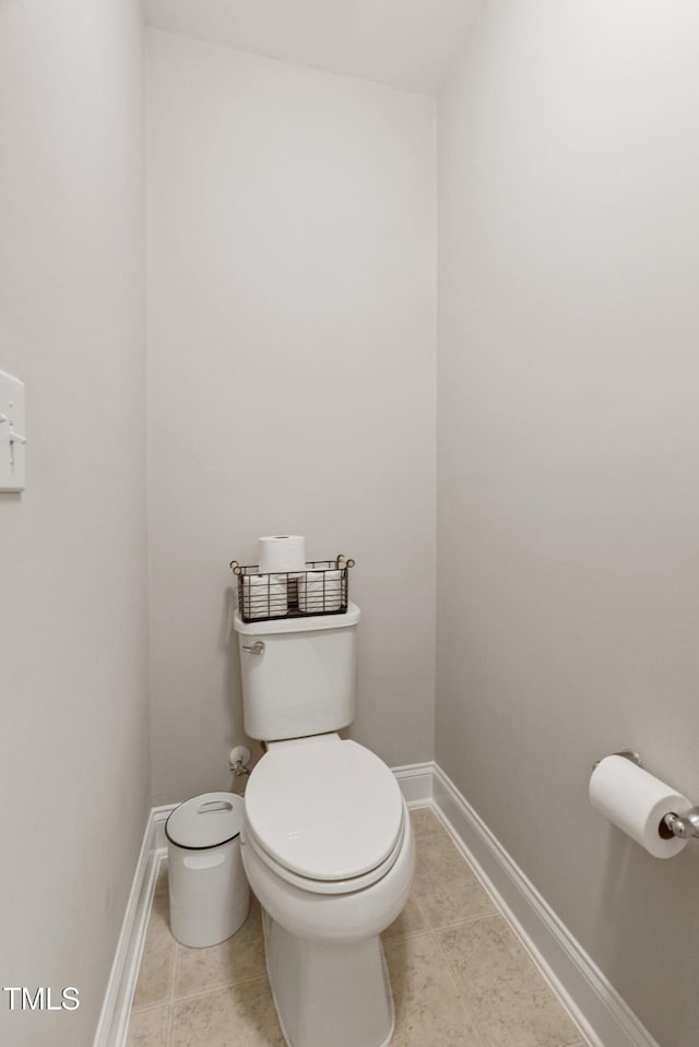 bathroom featuring tile patterned flooring and toilet