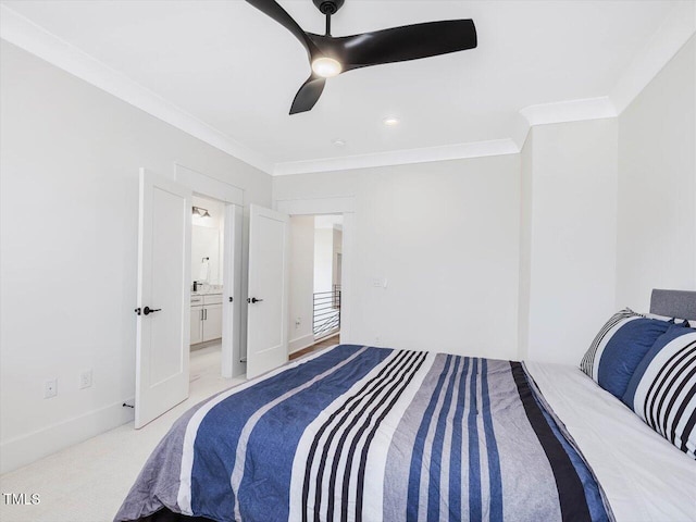 bedroom with ornamental molding, a ceiling fan, light carpet, connected bathroom, and baseboards