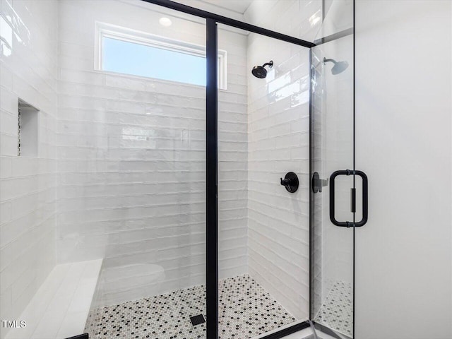 bathroom featuring a stall shower