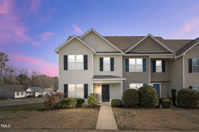 view of front of home with a lawn