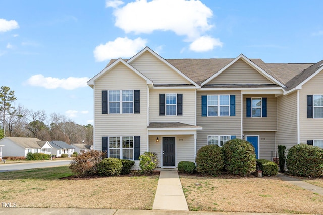 view of front of home with a front lawn