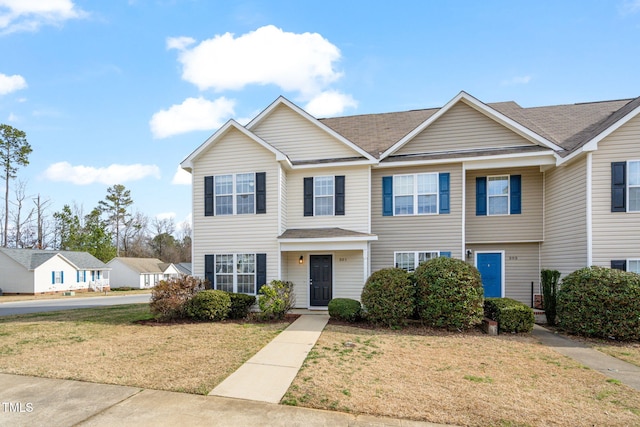 view of front of property with a front lawn