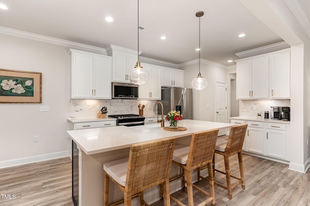 349 Shadow Falls Dr, Wendell, NC 27591 - kitchen with stainless steel appliances, light wood-type flooring, a sink, tasteful backsplash, and light countertops