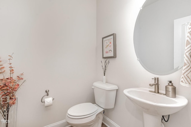 349 Shadow Falls Dr, Wendell, NC 27591 - half bathroom with toilet, baseboards, and a sink