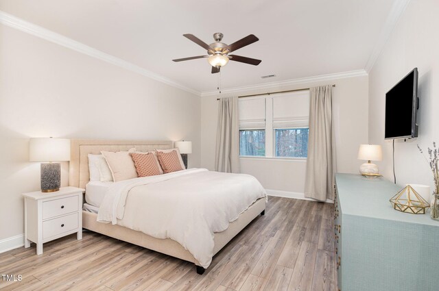 349 Shadow Falls Dr, Wendell, NC 27591 - bedroom featuring crown molding, light wood-style floors, baseboards, and a ceiling fan