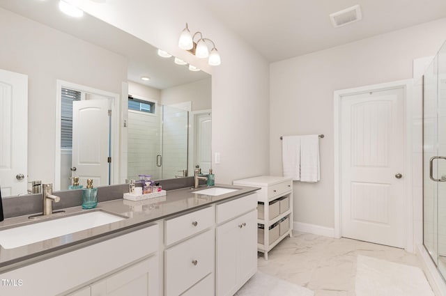 349 Shadow Falls Dr, Wendell, NC 27591 - bathroom with marble look tile flooring, a stall shower, double vanity, and baseboards