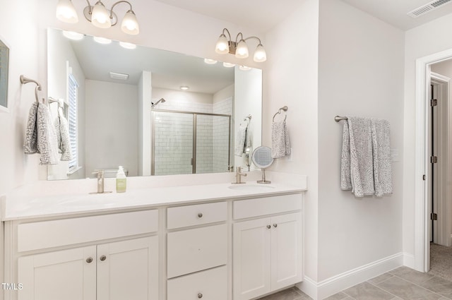 349 Shadow Falls Dr, Wendell, NC 27591 - full bathroom featuring a shower stall, double vanity, tile patterned floors, and baseboards