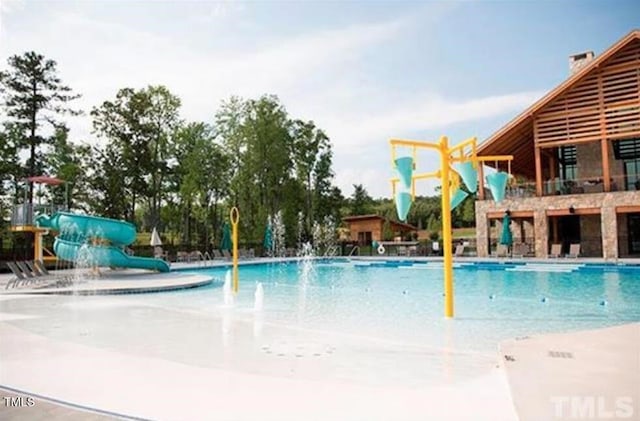 349 Shadow Falls Dr, Wendell, NC 27591 - community pool with a water play area and a water slide