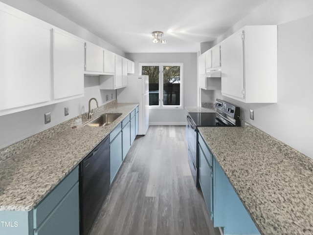 kitchen featuring sink, hardwood / wood-style flooring, blue cabinetry, white cabinetry, and black appliances