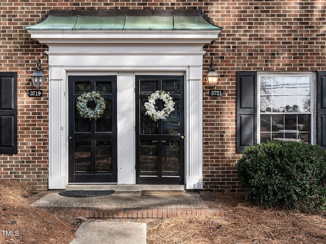 view of exterior entry featuring french doors