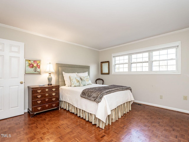 bedroom with visible vents, baseboards, and crown molding