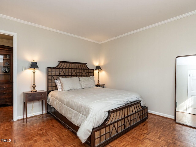 bedroom with crown molding and baseboards