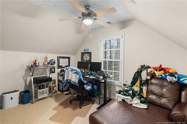 office featuring lofted ceiling, a textured ceiling, light colored carpet, and ceiling fan