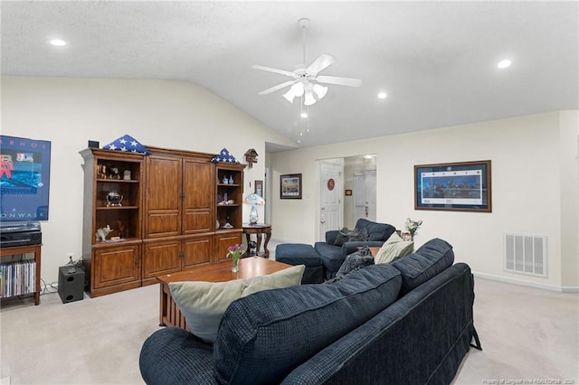 carpeted living room with lofted ceiling and ceiling fan