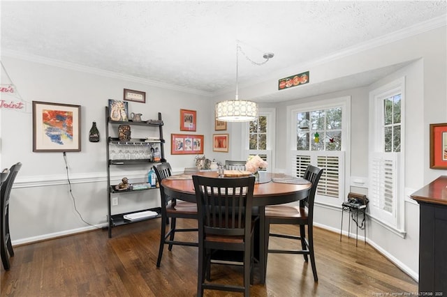 dining area with crown molding, dark hardwood / wood-style floors, and a textured ceiling