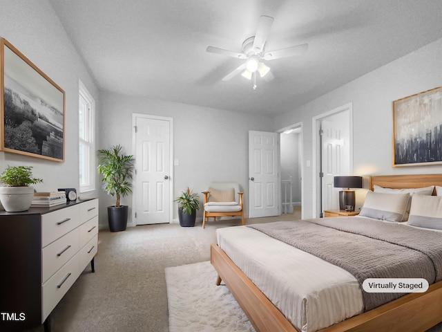 carpeted bedroom with ceiling fan