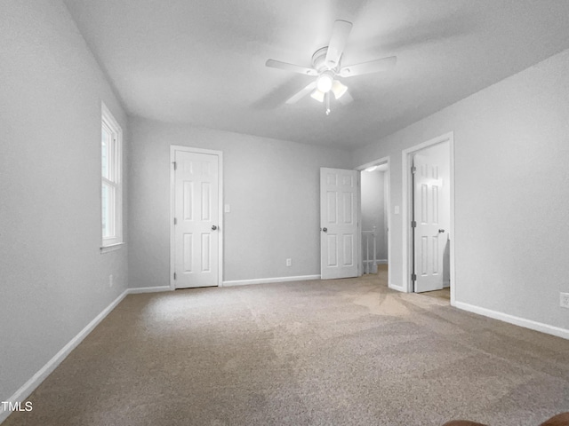 unfurnished bedroom with carpet floors and ceiling fan