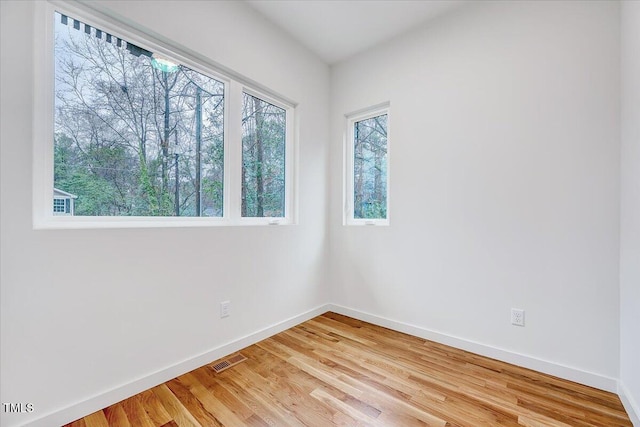 empty room with wood-type flooring