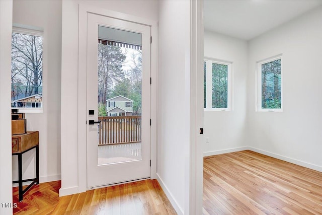 doorway with light wood-type flooring