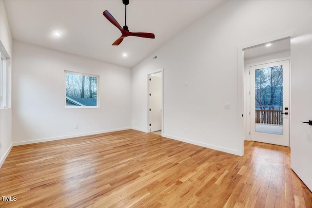 unfurnished room featuring ceiling fan, high vaulted ceiling, and light hardwood / wood-style floors