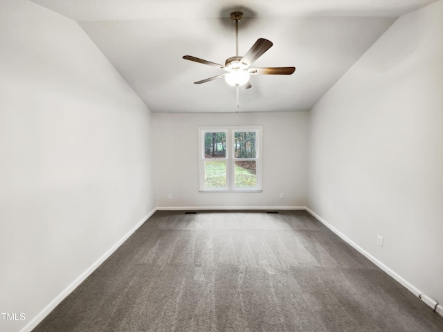 carpeted empty room with lofted ceiling and ceiling fan