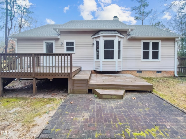 back of house with a deck and a patio area