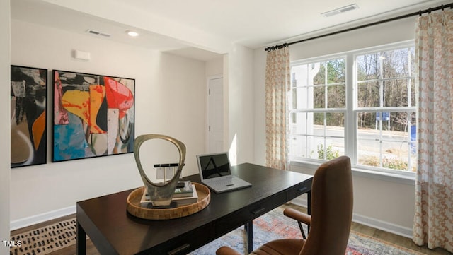 home office with hardwood / wood-style floors