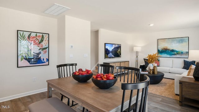 dining room with dark hardwood / wood-style floors