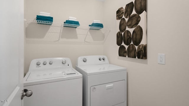 washroom with washer and dryer