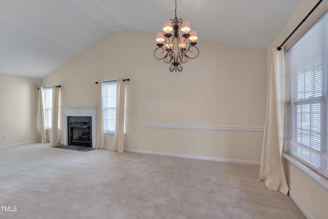 unfurnished living room with high vaulted ceiling, light carpet, and a notable chandelier