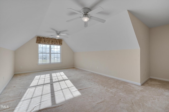 bonus room featuring ceiling fan, light colored carpet, and lofted ceiling