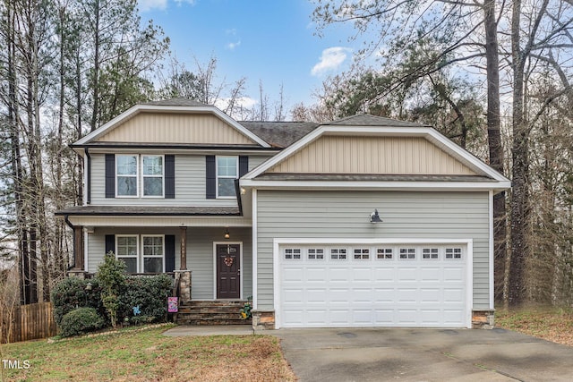 view of front facade featuring a garage, a porch, and concrete driveway