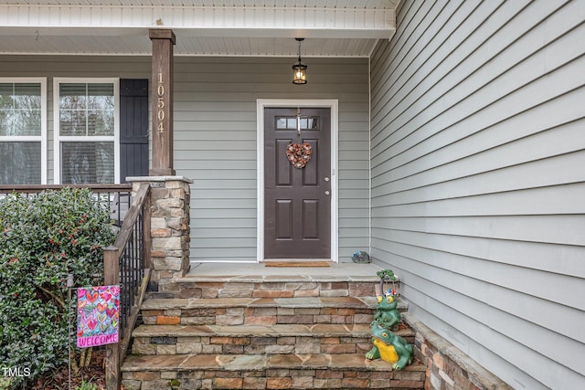 doorway to property with a porch