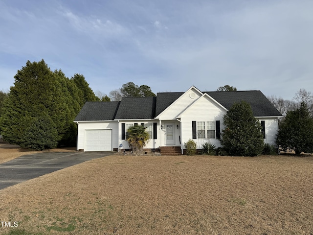 view of front of property with a garage and a front yard