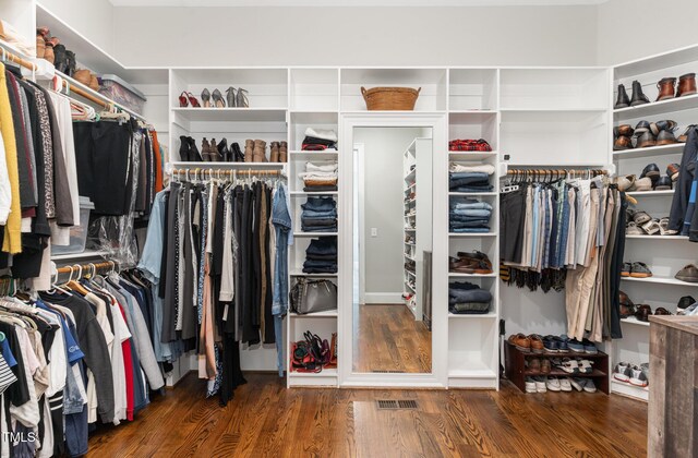 spacious closet featuring visible vents and wood finished floors