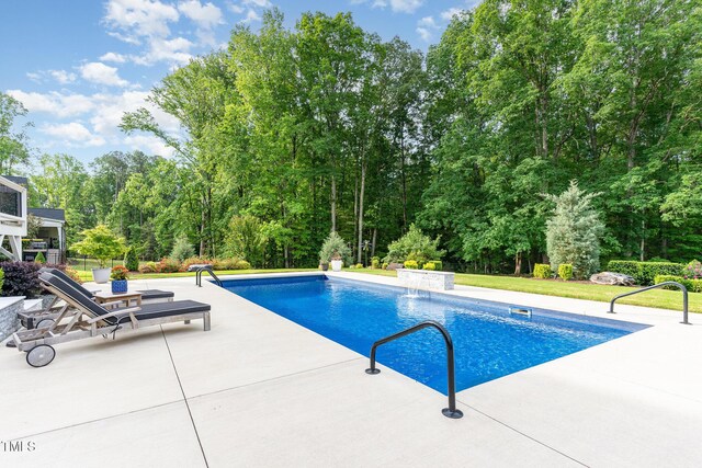 pool featuring a patio area