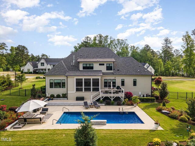 rear view of property featuring a fenced backyard, a wooden deck, a patio area, and stairway