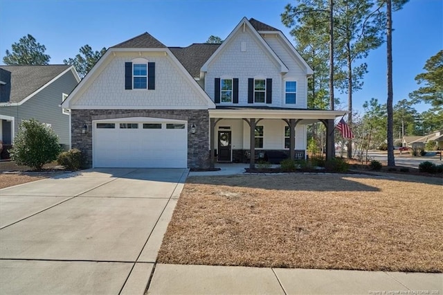 craftsman-style home with a garage and a porch