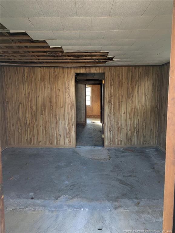 empty room with wood walls