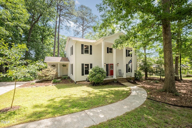 neoclassical / greek revival house with a front yard