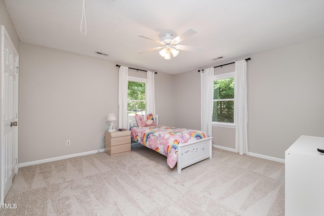 bedroom with visible vents, carpet flooring, and baseboards