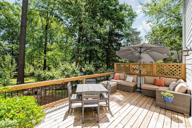 wooden deck with an outdoor living space and outdoor dining area