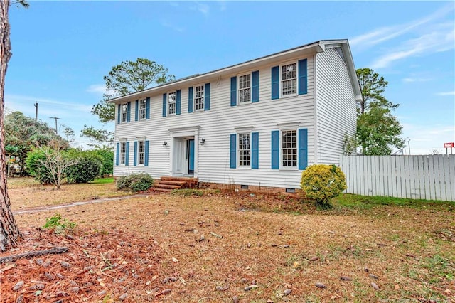 colonial home with a front yard