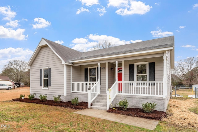 single story home featuring a porch and a front yard