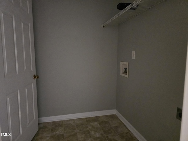 washroom featuring laundry area, hookup for a washing machine, and baseboards