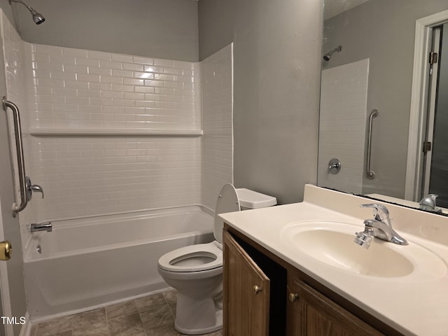 bathroom with tub / shower combination, vanity, and toilet