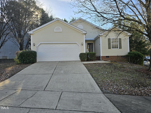 single story home featuring a garage, concrete driveway, and crawl space