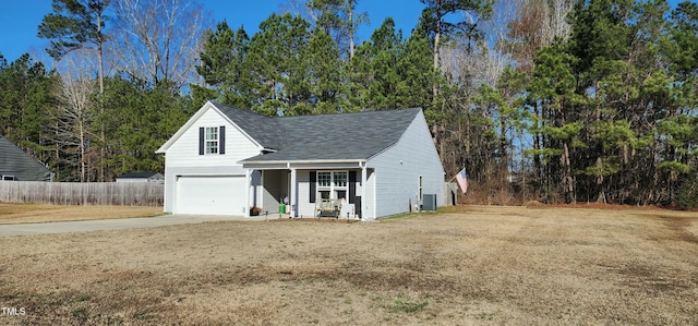 view of front of house featuring a garage, central AC, and a front yard