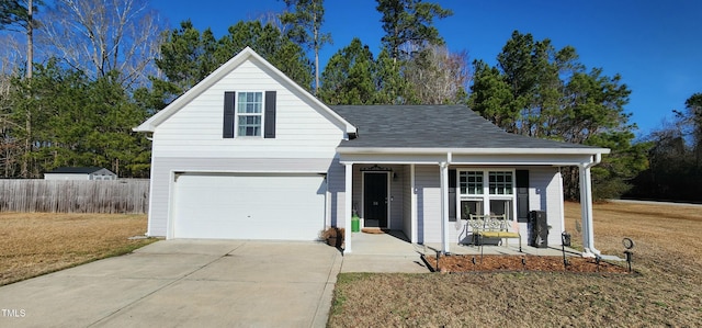 view of front property featuring a porch, a garage, and a front yard